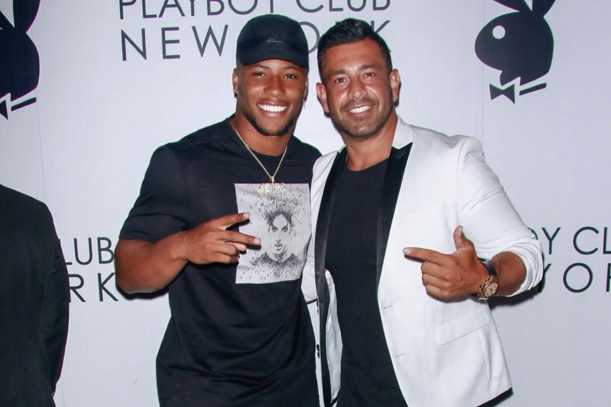 Two guests posing together at a club celebration
