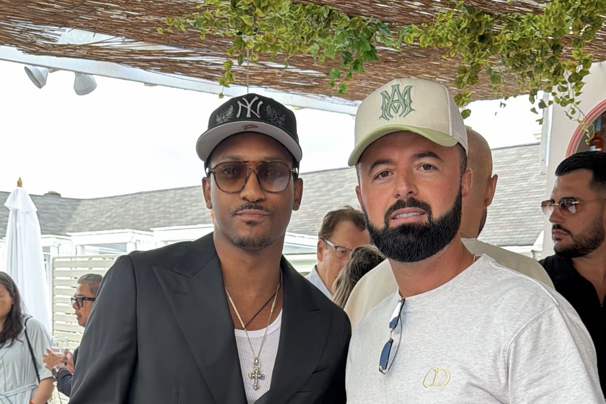 Two guests at an outdoor daytime gathering