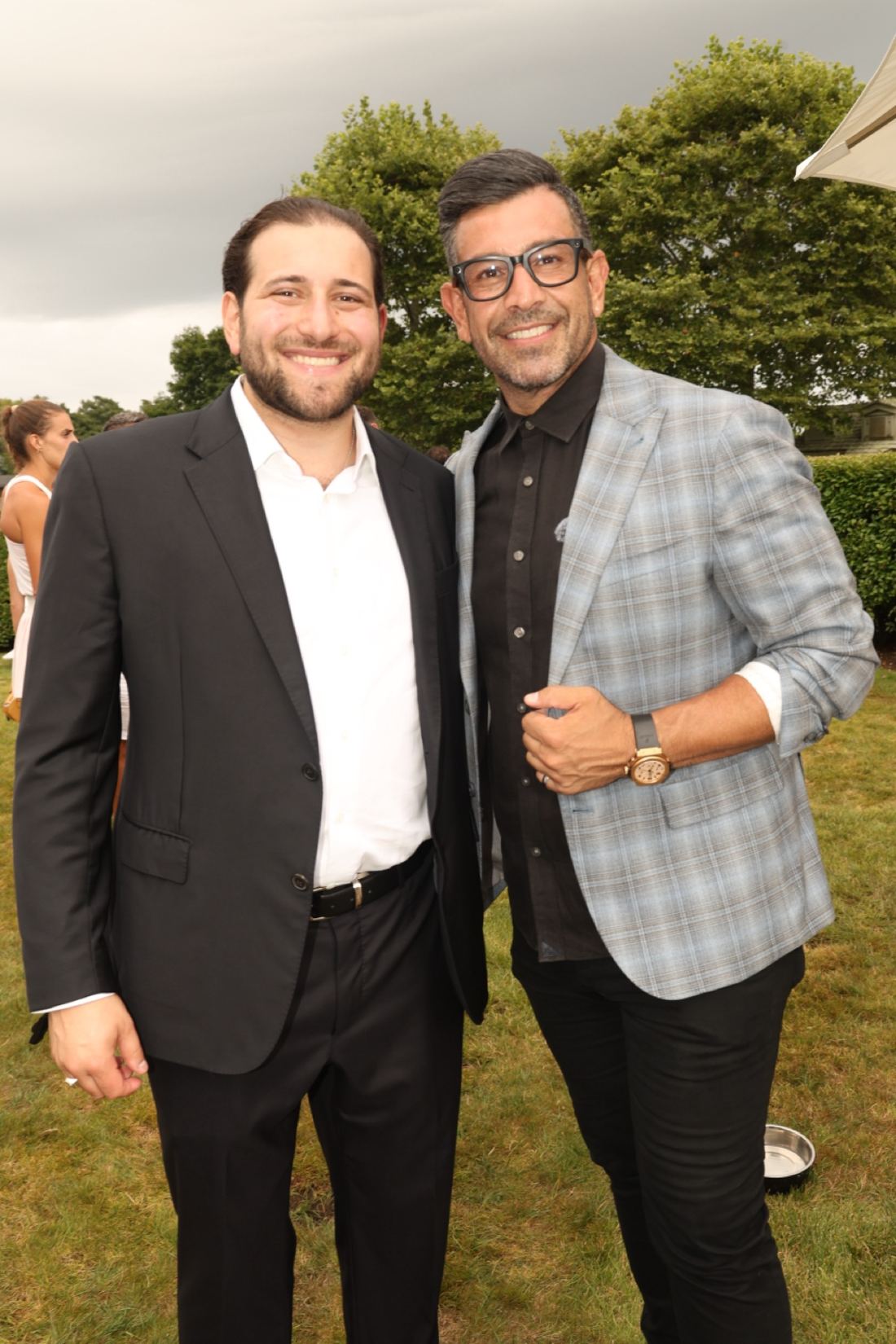 Guests at the SOCIAL8 Hamptons debut in a garden setting