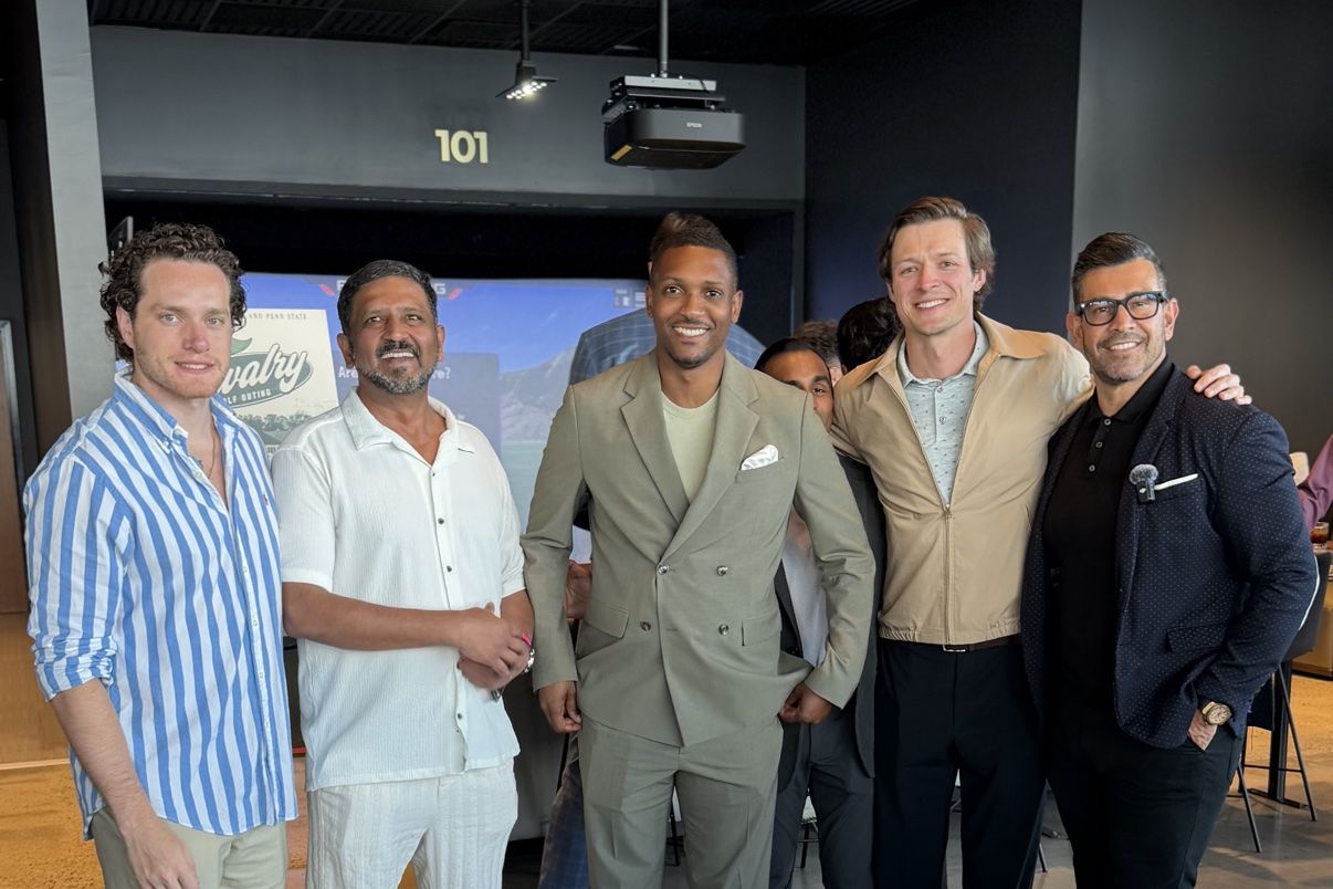 Members gathered at an indoor golf lounge